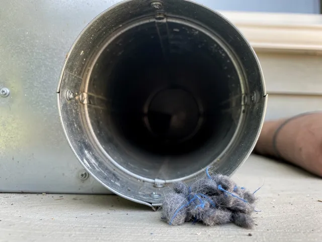 Northborough Dryer Vent Cleaning technician using specialized equipment to clear severe dryer vent blockage in Northborough